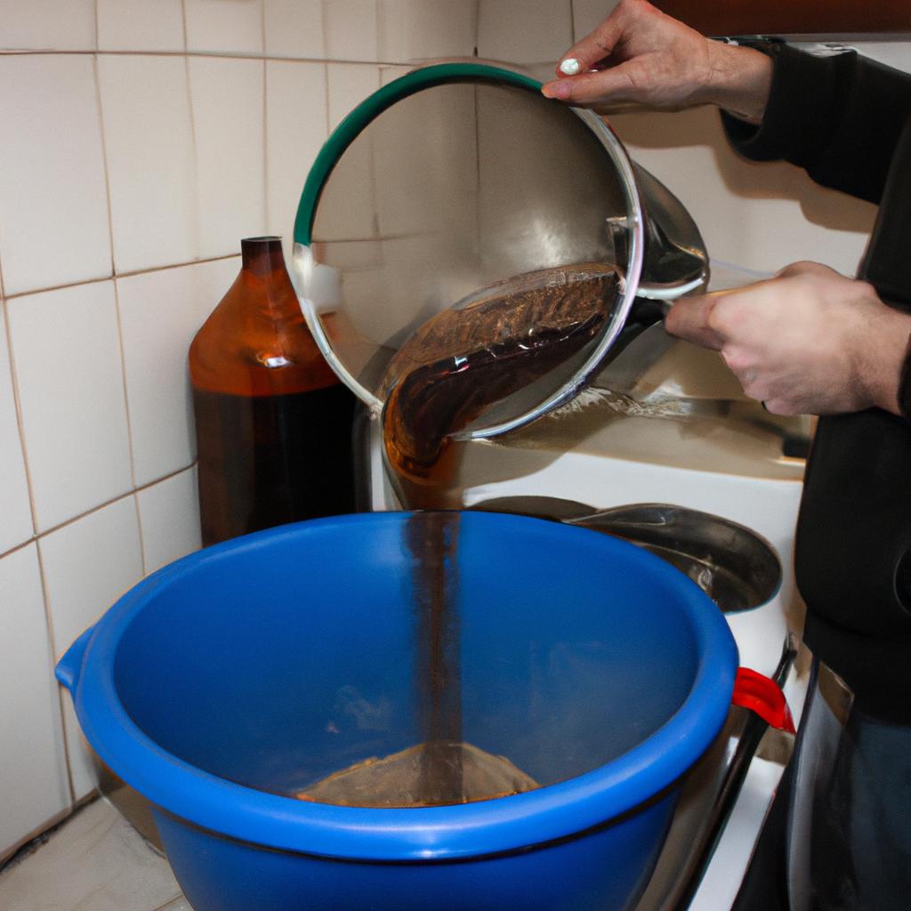 Person brewing beer at home